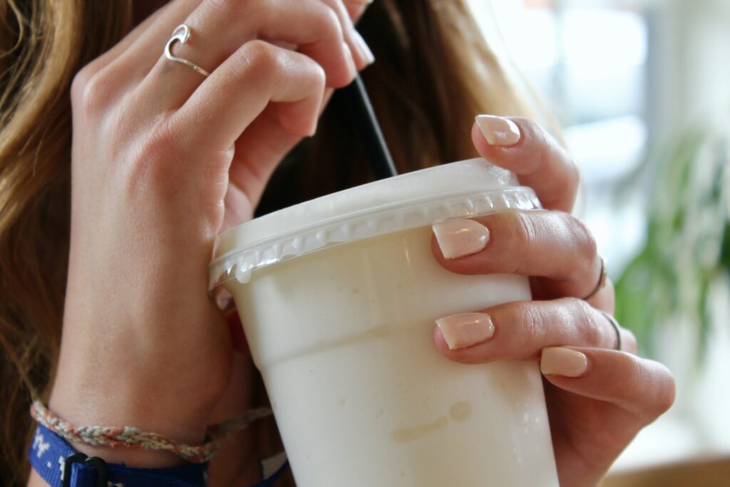 Person drinking protein coffee.