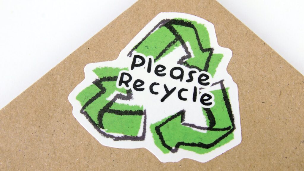 Recycled Cardboard with “Please Recycle” sticker.