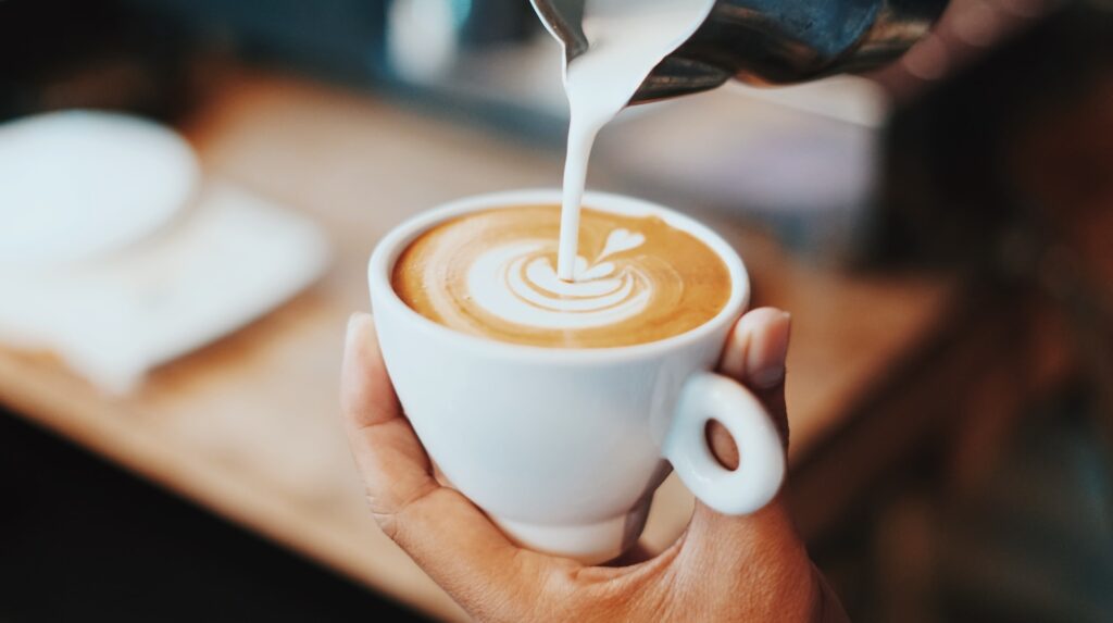 Latte art being poured.