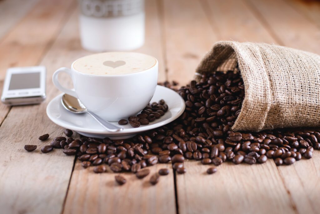 Coffee beans and a latte on display.