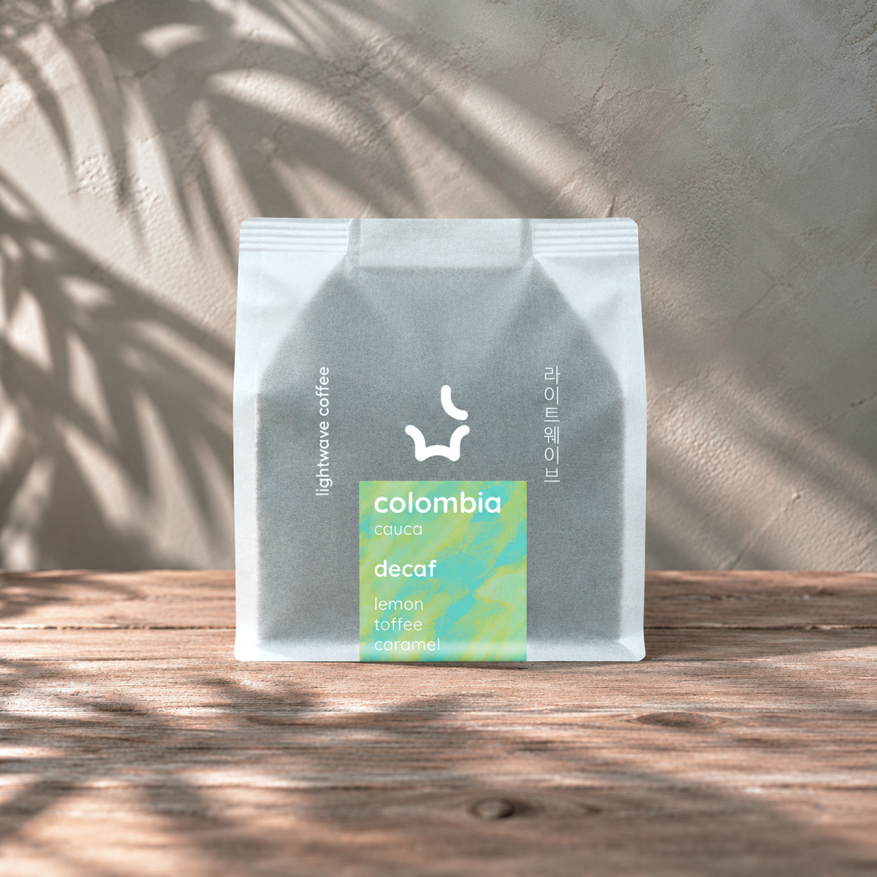 Lightwave Coffee Colombia Valle Del Cauca Decaf Sugarcane EA Process Decaf coffee bag on counter
