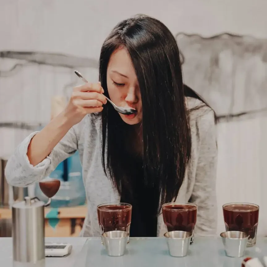 Woman Tasting Coffee